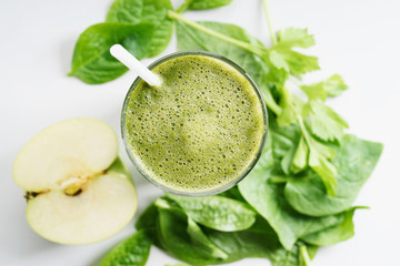 glass of fresh green spinach and kale healthy smoothie