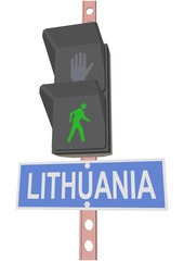 traffic light and a sign with the text 