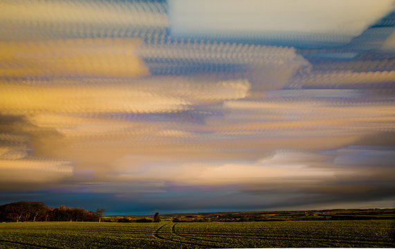 timelapse movement of clouds with long reaching scenic landscape