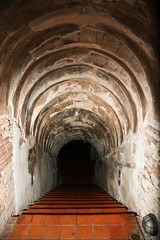 tunnel background and business concept. tunnel with old brick. the end of tunnel and concept business successfully. mystery tunnel or mystery way. tunnel damaged and waited for repair.