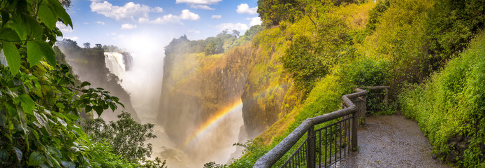 Victoria Falls waterfall panorama in Africa, between Zambia and Zimbabwe, one of the seven wonders of the world - obrazy, fototapety, plakaty