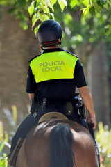 Policeman riding a horse in Málaga Spain
