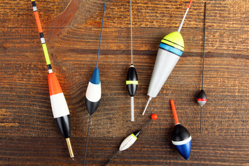 set of fishing floats on a brown wooden background © Studio KIVI
