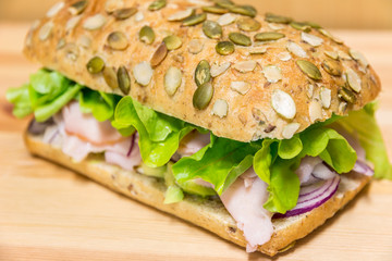 Sanwich roll on wooden table.tif