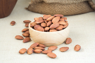 Almond in bowl wood on table