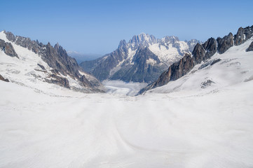 Rocks and peaks of the mountains in summer season, close to the sky. French Alps, Mont Blanc massif, Chamonix.