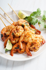 grilled shrimp kababs with sriracha and lime.