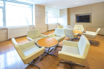 round table and elegant chairs in luxury hotel lobby