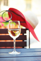 Glass of fresh delicious white wine in summer restaurant. Outdoo