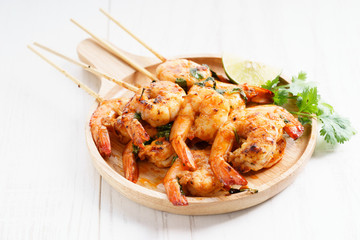 grilled shrimp kababs with sriracha and lime.