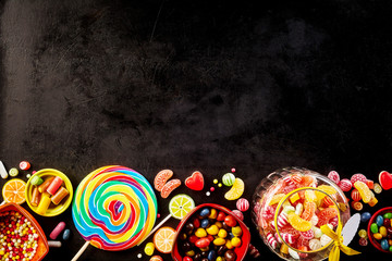 Black background with row of confections at bottom