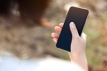 Woman using her Mobile Phone