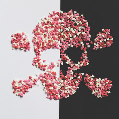 still life of sweets heart in skull on a trend background, love is in the air ironic concept