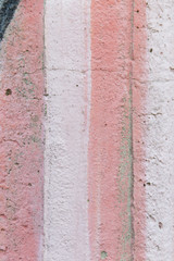 Pink stripes - Graffiti wall background - Detail of graffiti - Paint on a concrete wall.