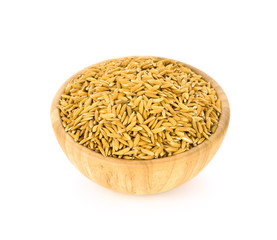 Paddy in a wooden bowl isolated on white background