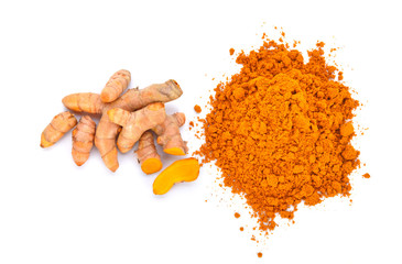 turmeric powder with turmeric root isolated on white