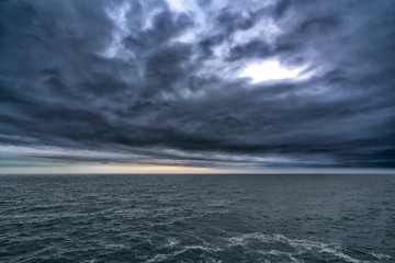Dark stormy cloud above the sea, dark tone nature abstract
