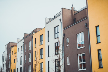 Row of colorful modern urban townhouses