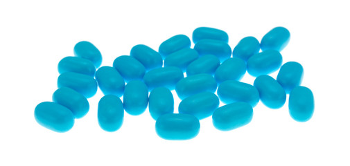 Side view of blue pills isolated on a white background
