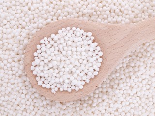 Tapioca pearls in wooden spoon