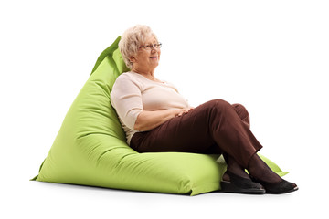 Relaxed lady sitting on a beanbag