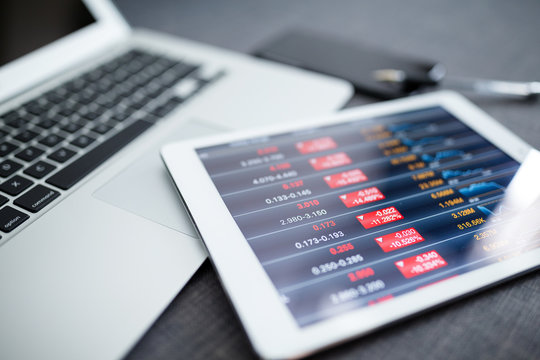 Analyzing stock market from digital tablet