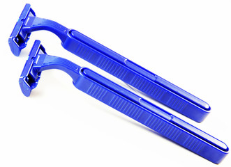 Two blue shaving razors  isolated on white background. Close up image.