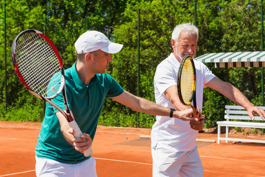 Tennis class with older man