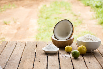 Raw material for food and dessert.Lemon and coconut powder and Sticky rice on old wooden background outdoor.Raw material Asia food.Raw material Indian food.