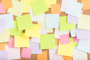 Empty blank sticky notes on notice board in office. Background or backdrop for business information. Concept image of communication or reminder with copy space. - 112205754
