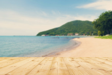 Wooden floor with sea beach background,retro or vintage style.