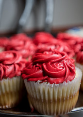 Close Up of Vanilla Cupcakes with Red Buttercream