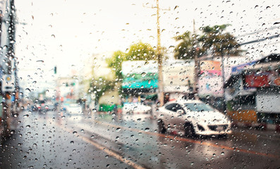Morning traffic ,view through the wind shield of rainy day.Selective focus.