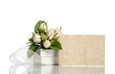 gift box and white roses with empty card for you text on white b