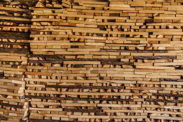firewood in the stack, close-up. Wooden background.