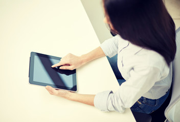 close up of woman hands with tablet pc at office