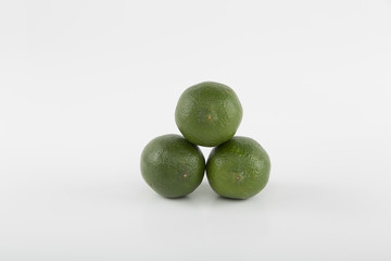 Three limes Stacked on a white background