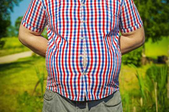 Man with overweight at outdoor in summer
