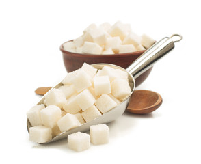 sugar cubes in scoop on white