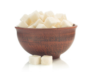 sugar cubes in bowl isolated on white background