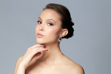 close up of beautiful woman face with earring