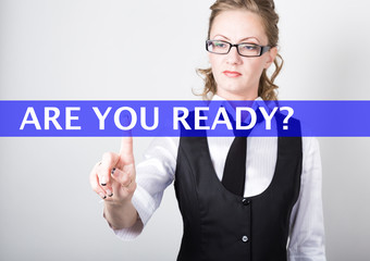 are you ready written on a virtual screen. Internet technologies in business and tourism. woman in business suit and tie, presses a finger on a virtual screen