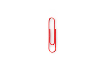 Obraz premium Red paper clip isolated on white background