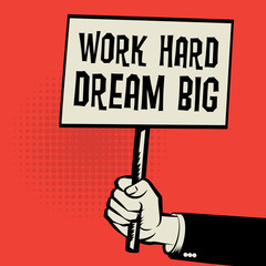 Poster in hand, business concept with text Work Hard, Dream Big