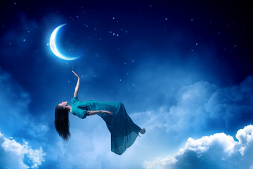 Woman in night sky