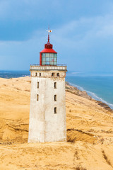 Fototapeta na wymiar Rabjerg mile a lighthouse on the Danish coast in a sand dune