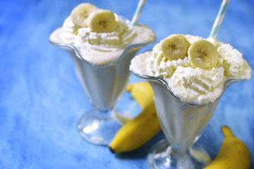 Banana milkshake with whipped cream.