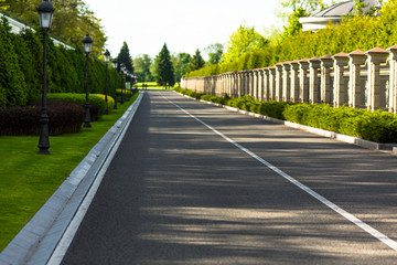 Image of wide open prairie with paved highway stretching out as far as eye can see. Carefree driving on a bright sunny day.