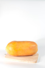 Papaya fruit on wood and white background copy space.(Soft focus.)