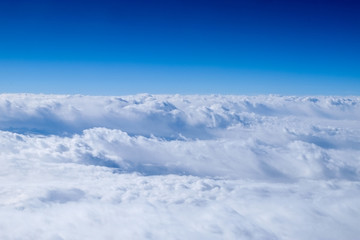 Fototapeta na wymiar Clouds from airplane window.